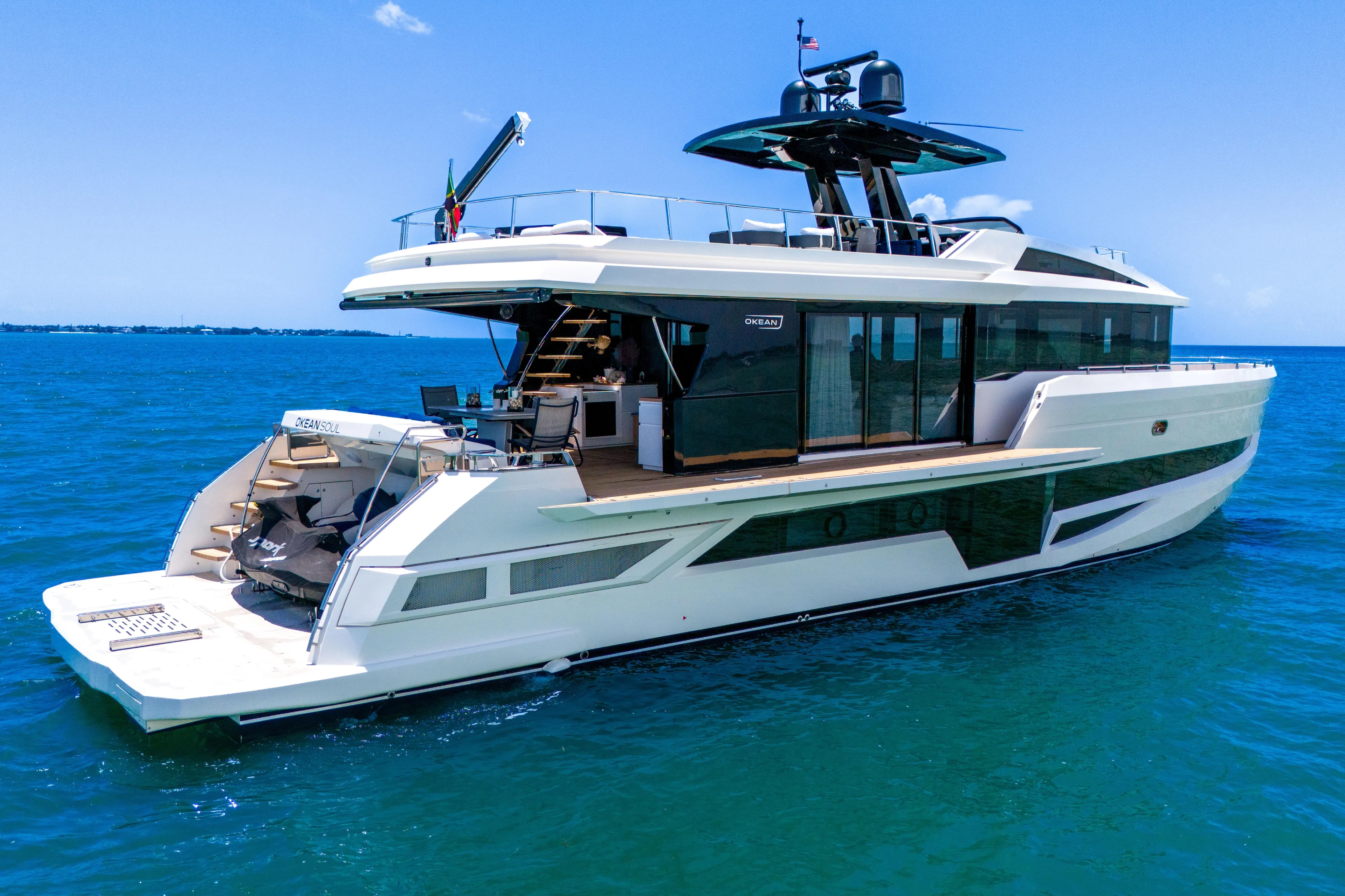  Yacht Photos Pics Luxury 2021 OKEAN 80 yacht cruising on clear blue ocean waters.