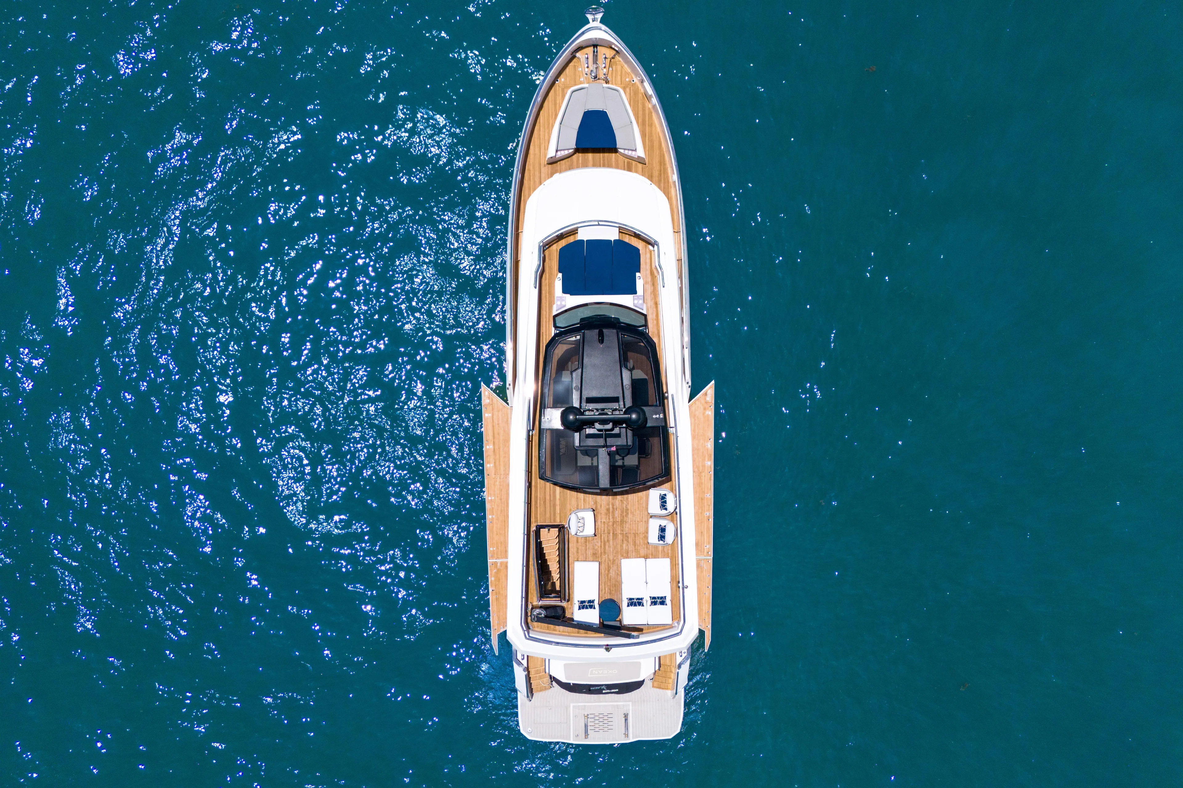  Yacht Photos Pics Aerial view of 2021 OKEAN 80 yacht on blue ocean water.