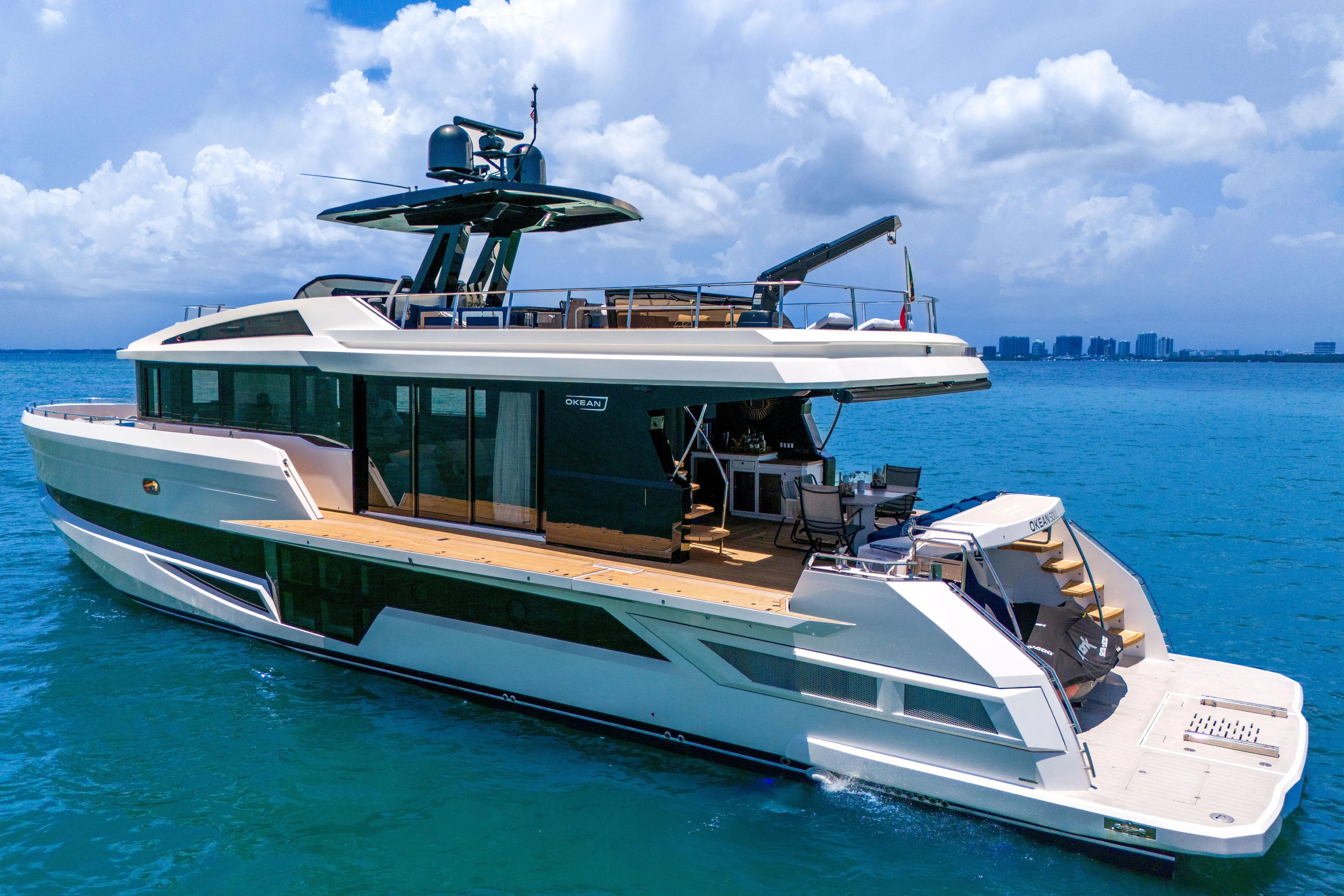  Yacht Photos Pics Luxurious 2021 OKEAN 80 yacht cruising on clear blue ocean waters.