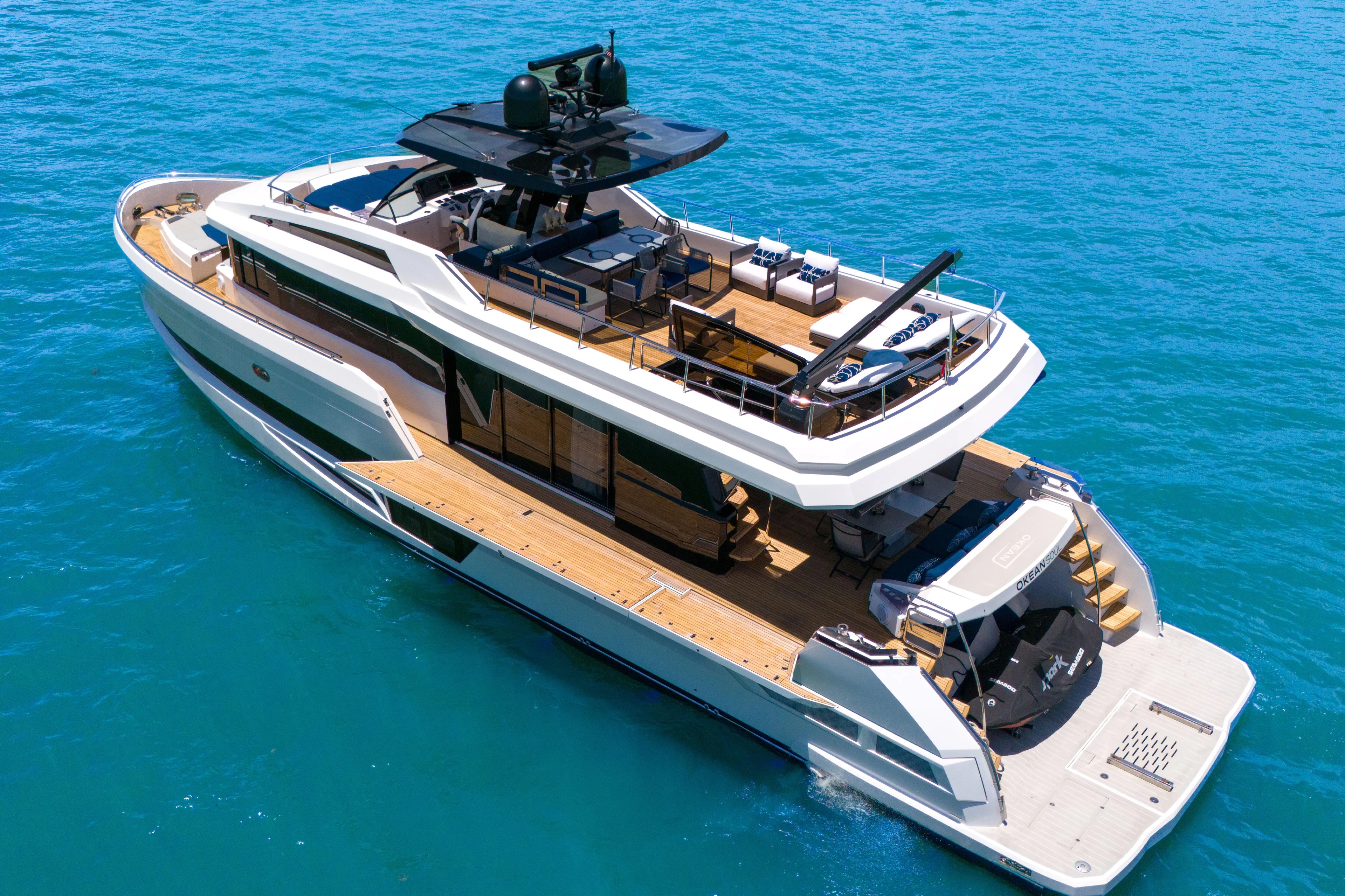 Yacht Photos Pics Luxurious 2021 OKEAN 80 yacht cruising on clear blue waters.