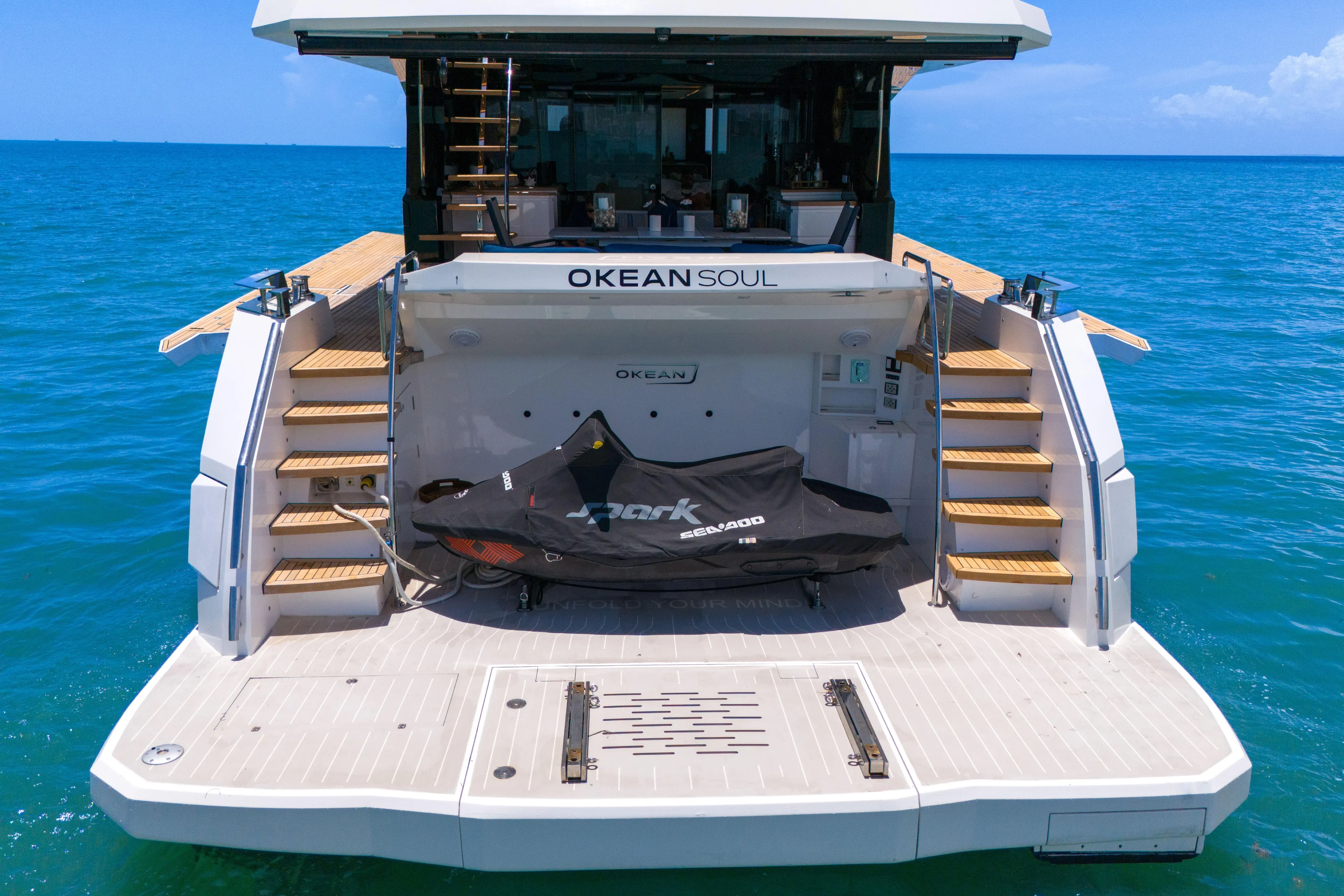  Yacht Photos Pics Luxury 2021 OKEAN 80 yacht with Sea-Doo jet ski on deck, ocean backdrop.