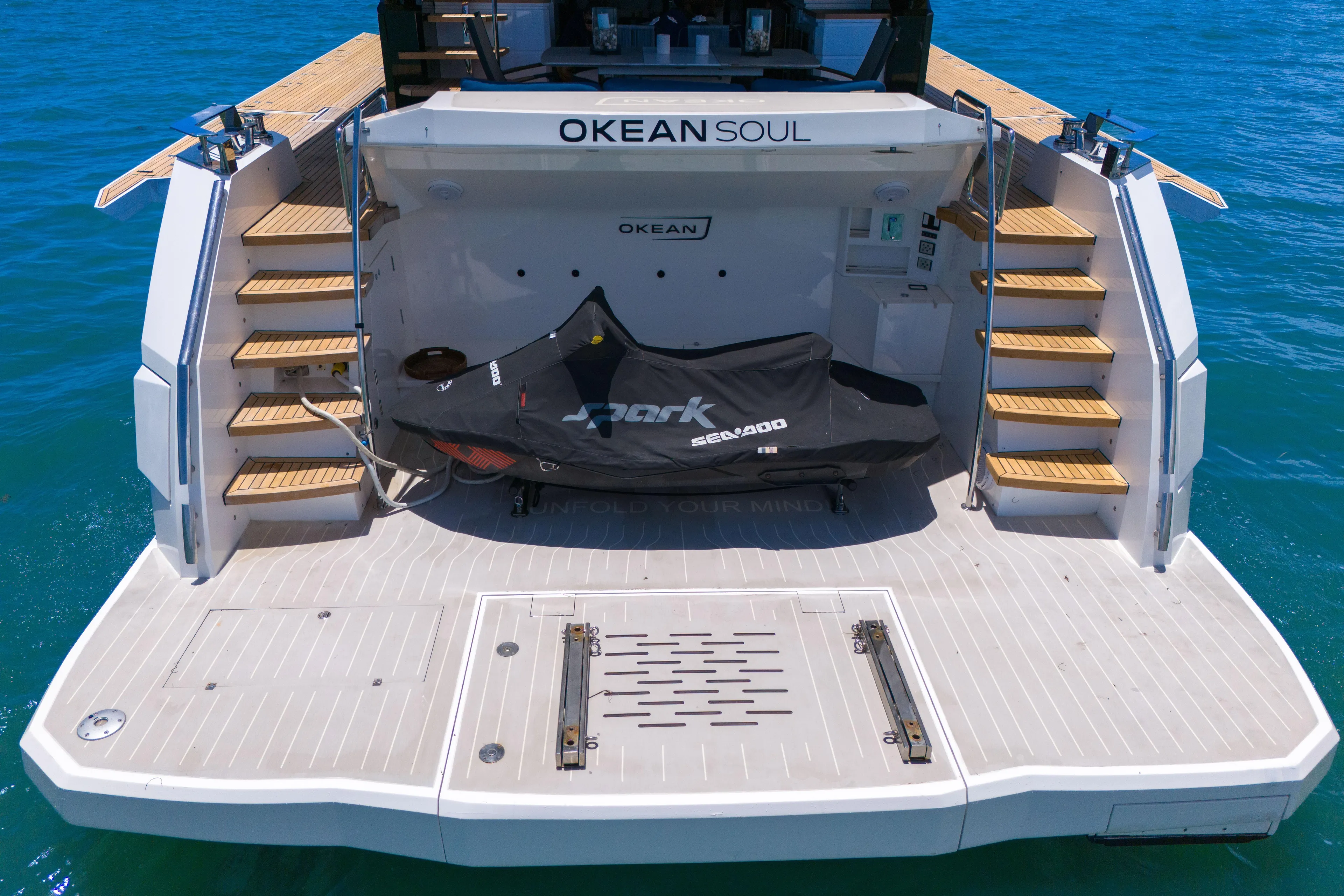  Yacht Photos Pics Luxury 2021 OKEAN 80 yacht stern with dual staircases and covered jet ski.