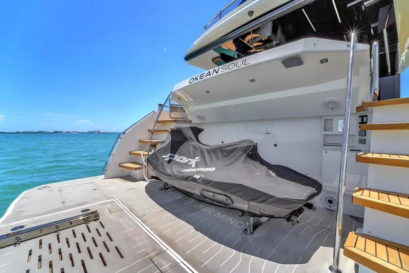  Yacht Photos Pics Luxury 2021 OKEAN 80 yacht with jet ski on deck, ocean view.