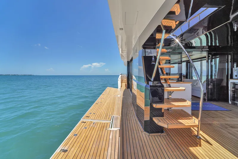  Yacht Photos Pics Luxurious 2021 OKEAN 80 yacht with sleek deck and modern staircase on open sea.