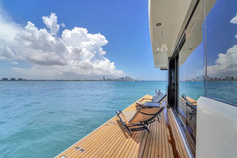  Yacht Photos Pics Luxury OKEAN 80 yacht deck with ocean view, 2021 model, under a bright blue sky.