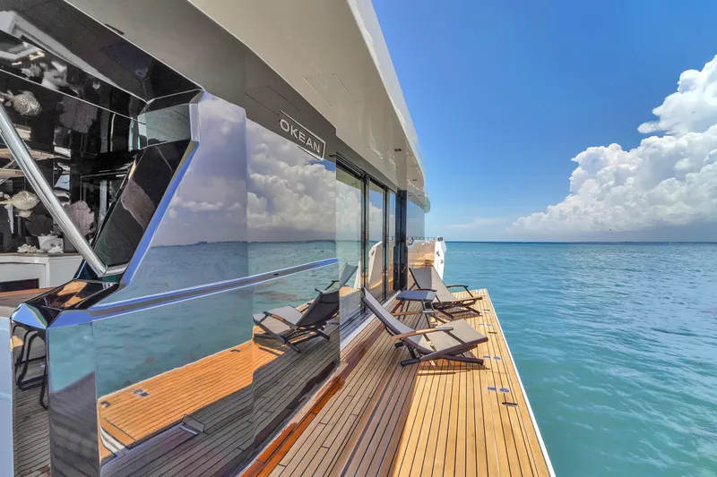  Yacht Photos Pics Luxury OKEAN 80 yacht deck with ocean view, 2021 model, featuring sleek design and lounge chairs.