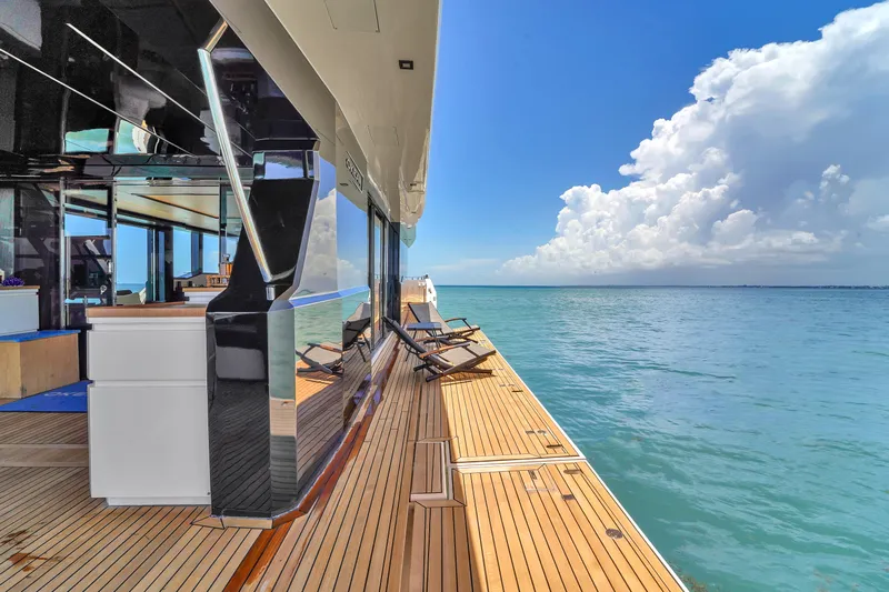  Yacht Photos Pics Luxurious 2021 OKEAN 80 yacht deck with ocean view and clear blue sky.