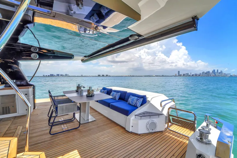  Yacht Photos Pics Luxurious 2021 OKEAN 80 yacht deck with ocean view, featuring elegant seating and dining area.