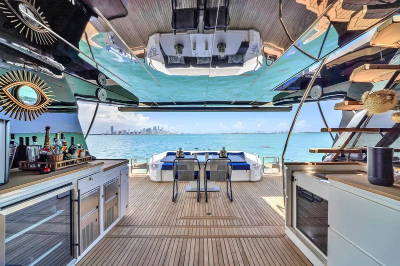  Yacht Photos Pics Luxurious 2021 OKEAN 80 yacht interior with ocean view, featuring modern bar and seating area.