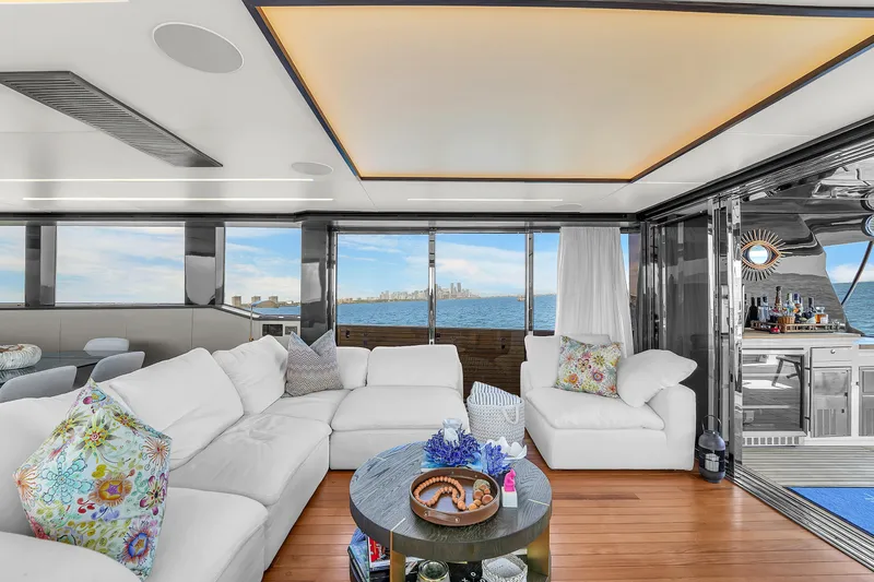  Yacht Photos Pics Luxurious 2021 OKEAN 80 yacht interior with elegant white seating and ocean view.