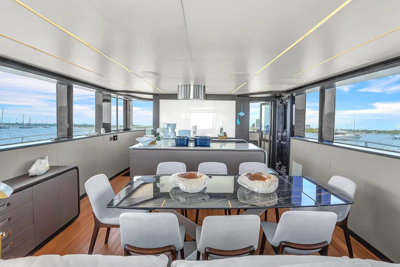  Yacht Photos Pics Luxurious interior of 2021 OKEAN 80 yacht with panoramic windows and elegant dining area.