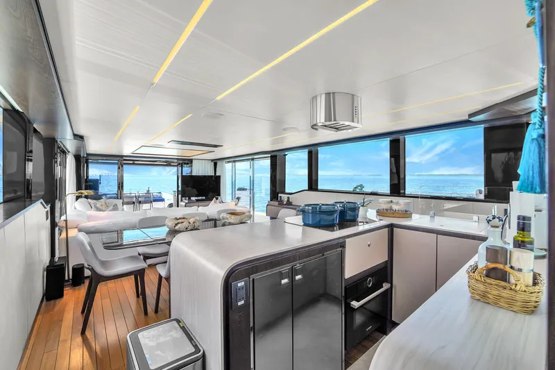  Yacht Photos Pics Luxurious interior of 2021 OKEAN 80 yacht with modern kitchen and ocean view.