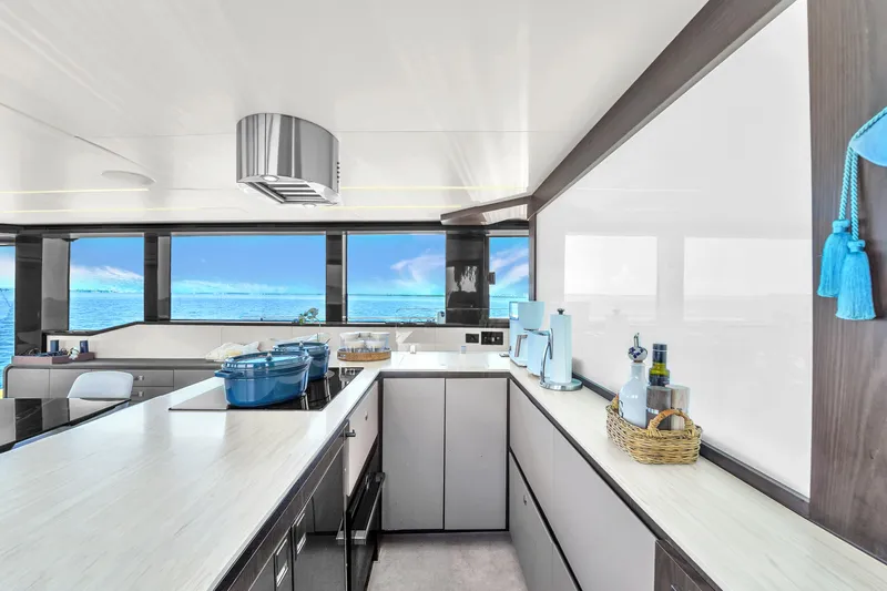  Yacht Photos Pics Luxurious kitchen interior on 2021 OKEAN 80 yacht with ocean view.
