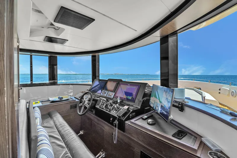  Yacht Photos Pics Interior of 2021 OKEAN 80 yacht cockpit with modern navigation equipment and ocean view.