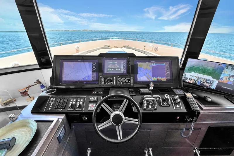  Yacht Photos Pics Cockpit of 2021 OKEAN 80 yacht with navigation screens and ocean view.