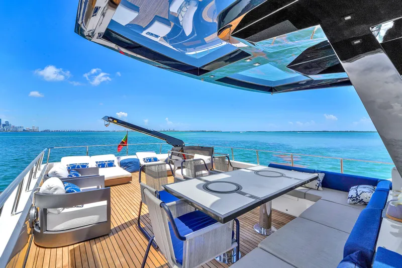  Yacht Photos Pics Luxurious 2021 OKEAN 80 yacht deck with elegant seating and ocean view.