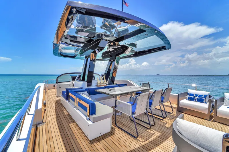  Yacht Photos Pics Luxurious 2021 OKEAN 80 yacht deck with modern seating and ocean view.