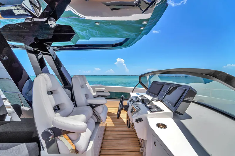  Yacht Photos Pics Luxury helm of 2021 OKEAN 80 yacht with ocean view and modern controls.