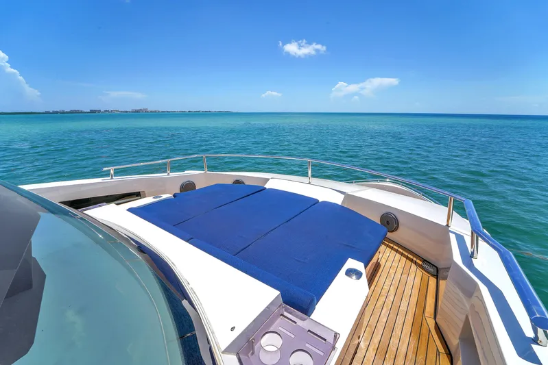  Yacht Photos Pics Luxurious 2021 OKEAN 80 yacht deck with sunbeds overlooking serene ocean view.
