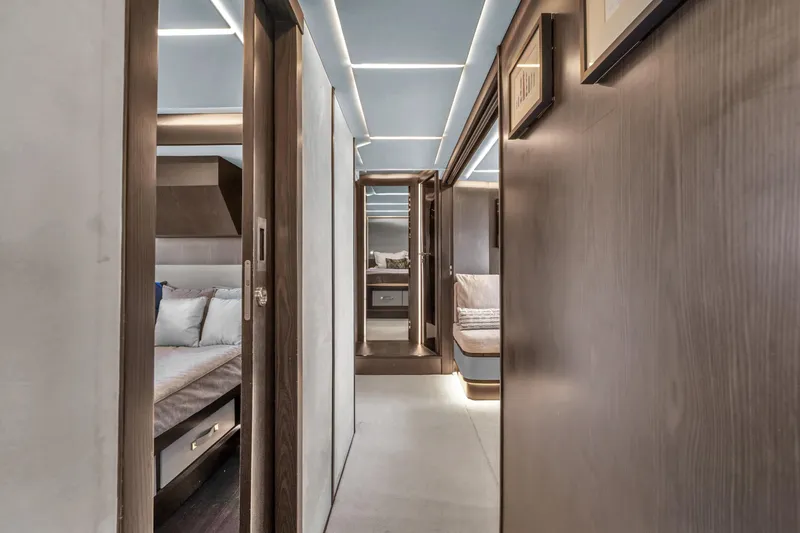  Yacht Photos Pics Luxurious interior of 2021 OKEAN 80 yacht, featuring modern design and elegant wood finishes.