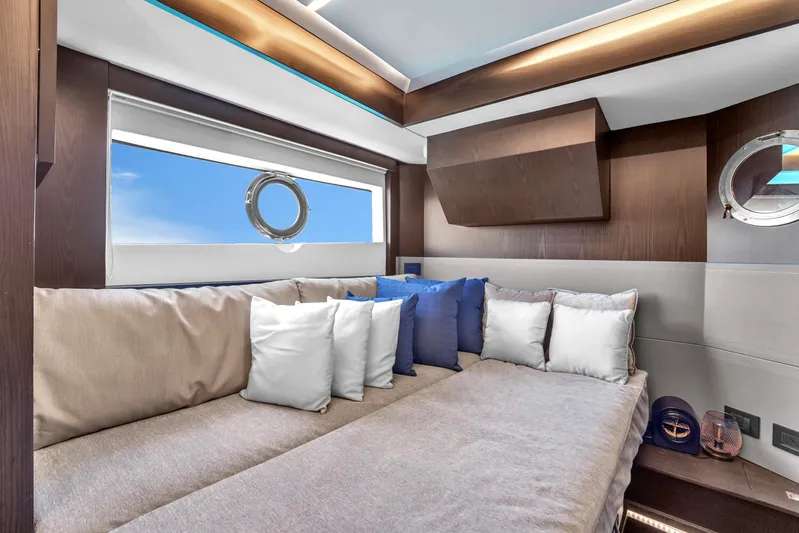 Yacht Photos Pics Luxurious interior of 2021 OKEAN 80 yacht with plush seating and porthole windows.