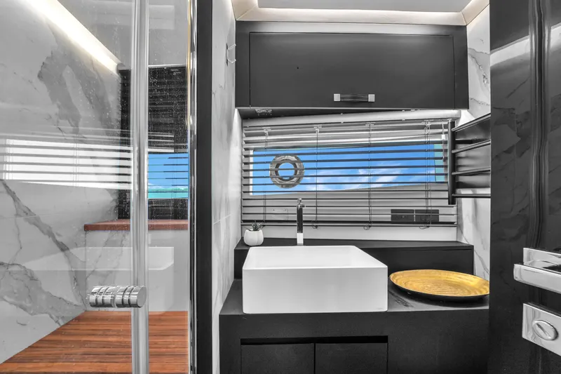  Yacht Photos Pics Modern bathroom interior on 2021 OKEAN 80 yacht, featuring sleek design and ocean view.