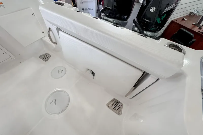  Yacht Photos Pics 2024 Wellcraft 263 Fisherman boat interior with seating and storage compartments.