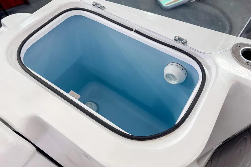  Yacht Photos Pics 2024 Wellcraft 263 Fisherman livewell with blue interior and secure lid.