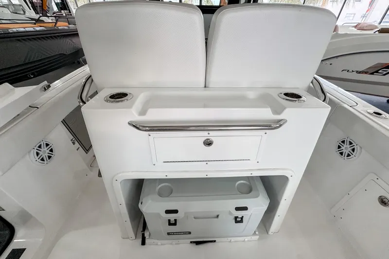  Yacht Photos Pics 2024 Wellcraft 263 Fisherman boat interior with seating and storage area.