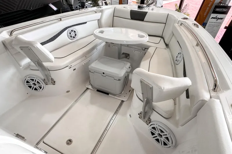  Yacht Photos Pics 2024 Wellcraft 263 Fisherman boat interior with white seating and round table.