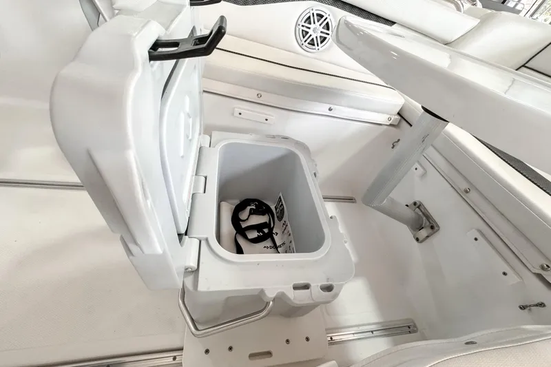  Yacht Photos Pics Open storage compartment on 2024 Wellcraft 263 Fisherman boat, featuring a white interior.