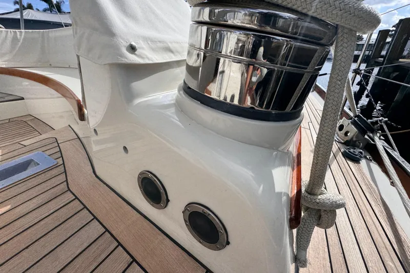 Entertainer Yacht Photos Pics Close-up of 1989 Little Harbor Sloop 58' deck with polished winch and teak flooring.