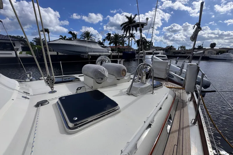 Entertainer Yacht Photos Pics 1989 Little Harbor Sloop 58' yacht deck with marina view, clear sky, and palm trees.
