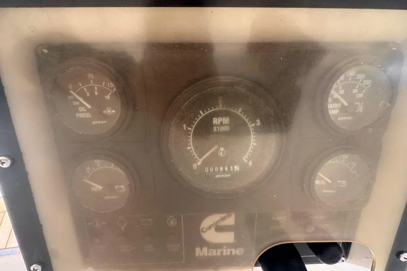 Entertainer Yacht Photos Pics Instrument panel of a 1989 Little Harbor Sloop 58', featuring RPM, oil, and temperature gauges.