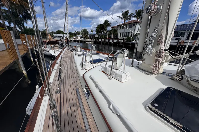 Entertainer Yacht Photos Pics 1989 Little Harbor Sloop 58' docked, showcasing deck and rigging under a blue sky.