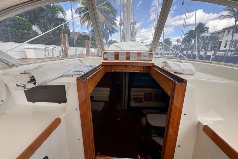 Entertainer Yacht Photos Pics Interior view of 1989 Little Harbor Sloop 58' sailboat with wooden cabin entrance.