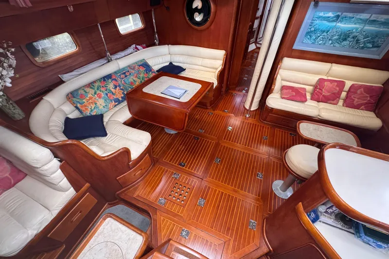 Entertainer Yacht Photos Pics Luxurious 1989 Little Harbor Sloop interior with elegant wood finish and plush seating.