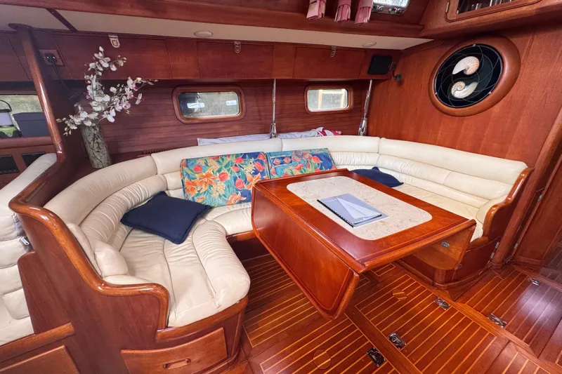Entertainer Yacht Photos Pics Luxurious 1989 Little Harbor Sloop 58' interior with elegant wood and leather seating.