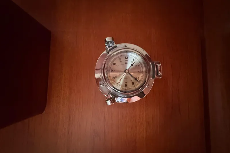 Entertainer Yacht Photos Pics Chrome nautical clock on wooden panel, Little Harbor Sloop 58', 1989.