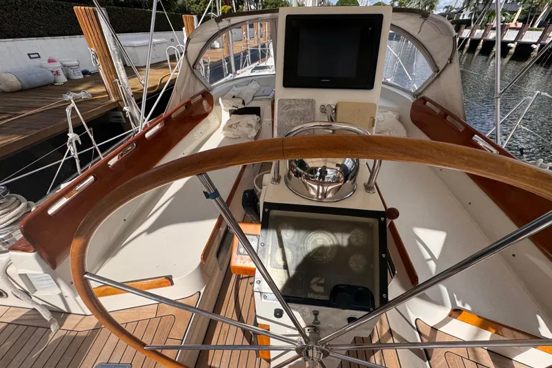 Entertainer Yacht Photos Pics Cockpit of a 1989 Little Harbor Sloop 58' with wooden steering wheel and navigation instruments.
