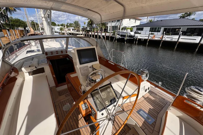 Entertainer Yacht Photos Pics 1989 Little Harbor Sloop 58' yacht cockpit with steering wheel and navigation equipment.