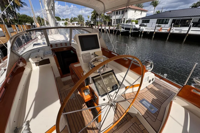 Entertainer Yacht Photos Pics Cockpit of 1989 Little Harbor Sloop 58' with wooden wheel and navigation instruments.