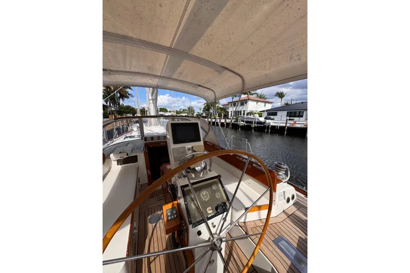 Entertainer Yacht Photos Pics 1989 Little Harbor Sloop 58' cockpit with wooden wheel and navigation equipment.