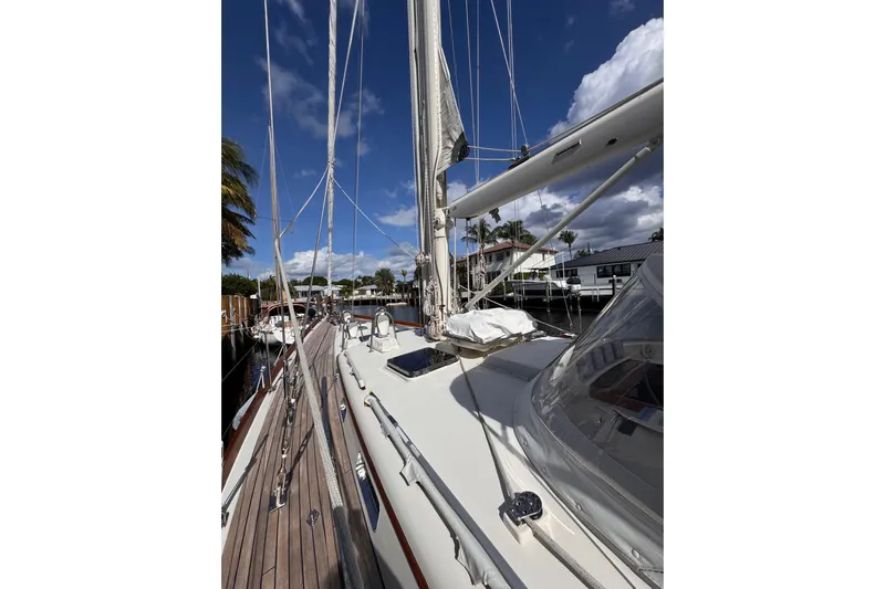 Entertainer Yacht Photos Pics 1989 Little Harbor Sloop 58' sailboat docked under a blue sky.