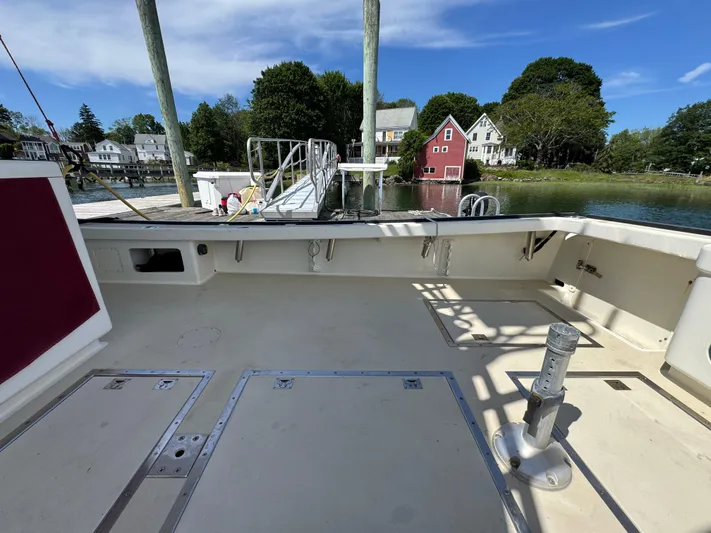 Chilla Yacht Photos Pics Northern Bay 36 boat deck, 2009 model, docked by scenic waterfront homes.