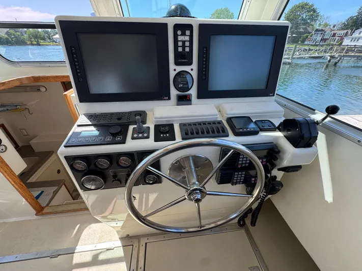 Chilla Yacht Photos Pics Helm of 2009 Northern Bay 36 boat with dual screens and navigation controls.