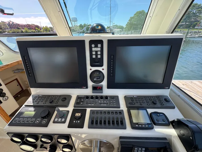 Chilla Yacht Photos Pics Control panel of a 2009 Northern Bay 36 boat with navigation screens and instruments.