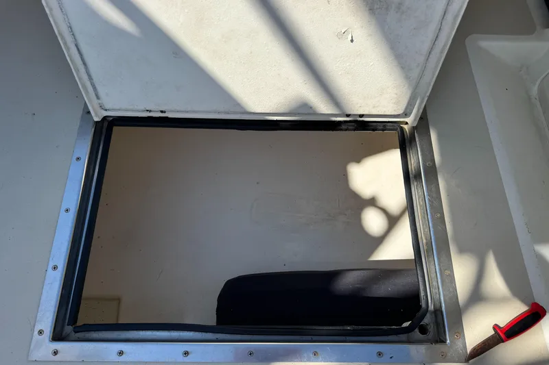 Chilla Yacht Photos Pics Open hatch on 2009 Northern Bay 36 boat deck with visible shadows.