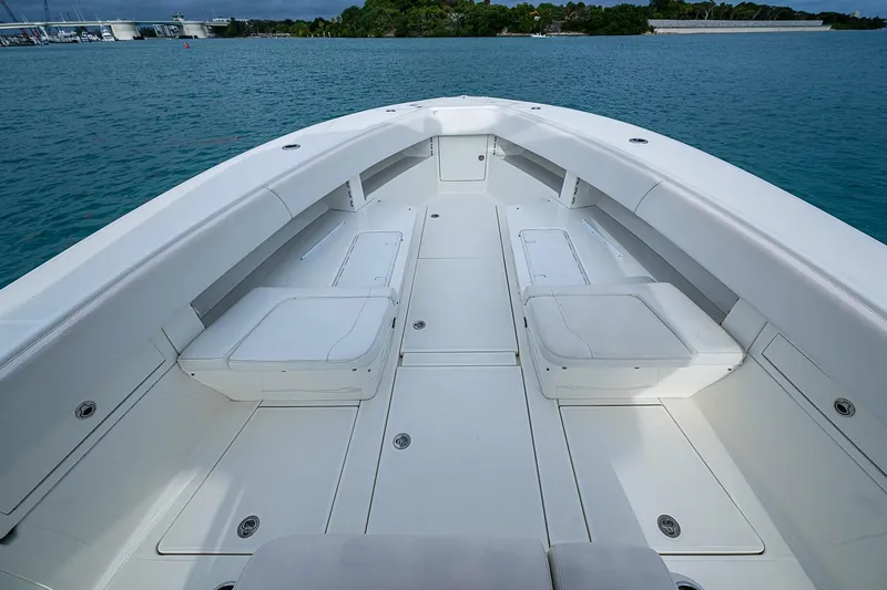 Fishy Business Yacht Photos Pics 2014 SeaVee 390B boat interior with spacious seating and storage, on calm blue water.