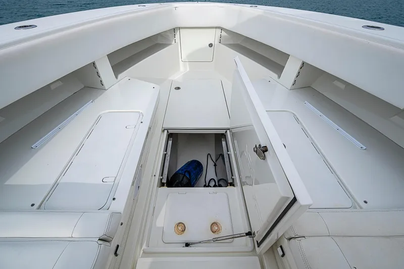 Fishy Business Yacht Photos Pics 2014 SeaVee 390B boat interior with open storage compartment, showcasing spacious design.
